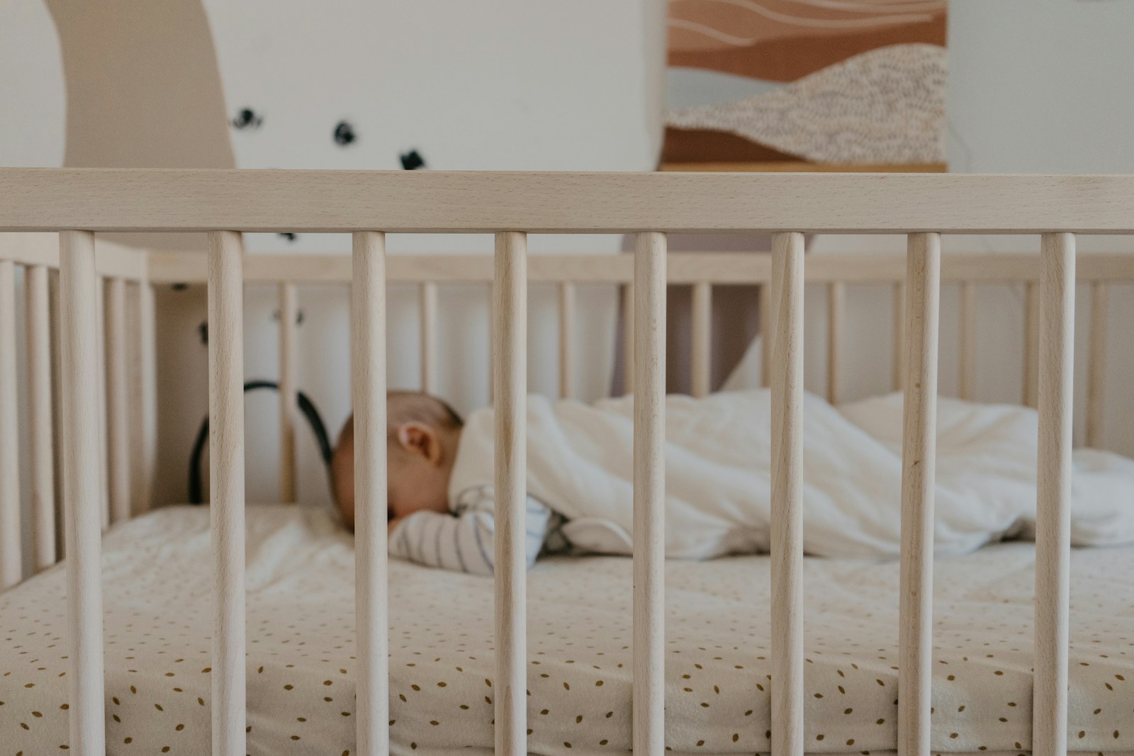 a person sleeping in a crib